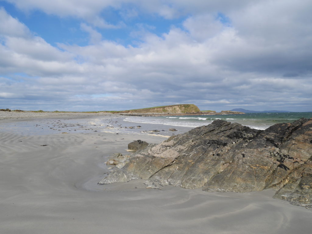 Tully beach - the headland leads to the white strand