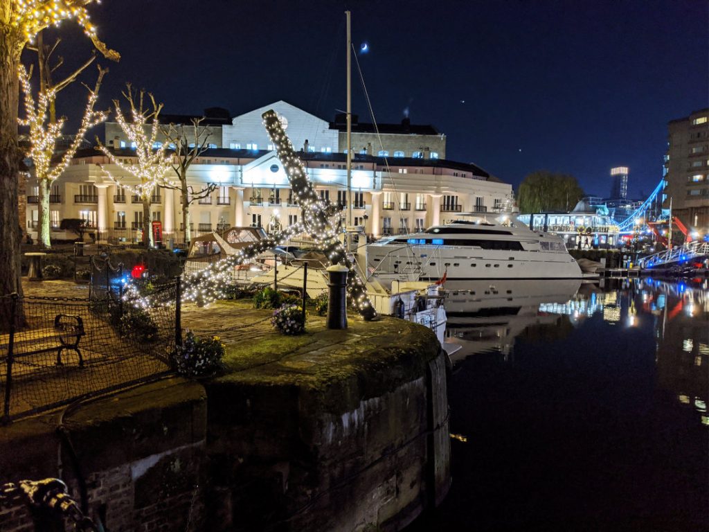 St Katherine's Docks at night giant anchor all lit up