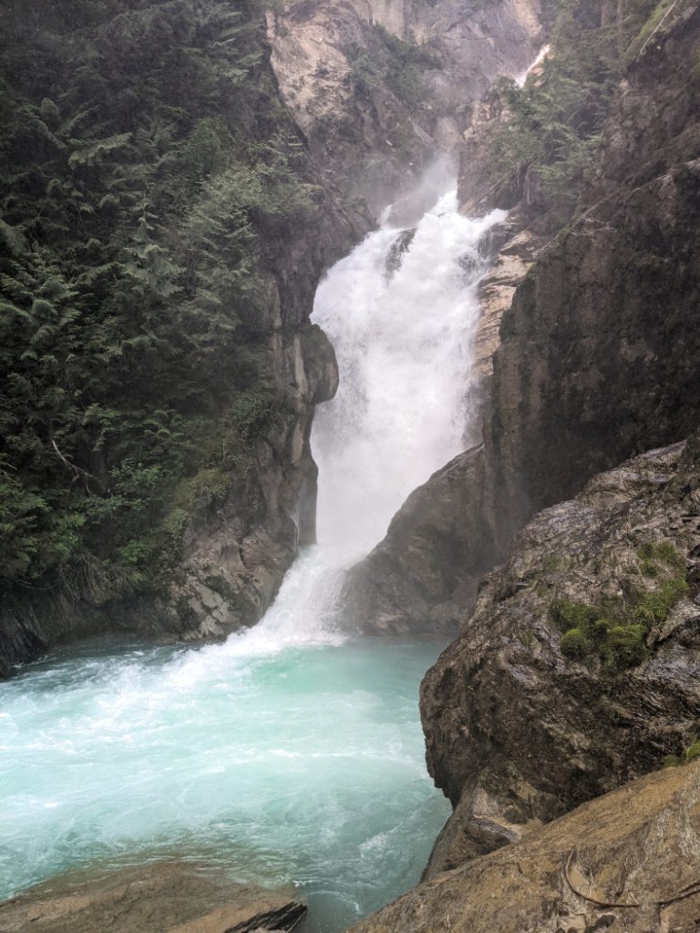 Beautiful Bear Creek Falls in Glacier National Park - vertical close up